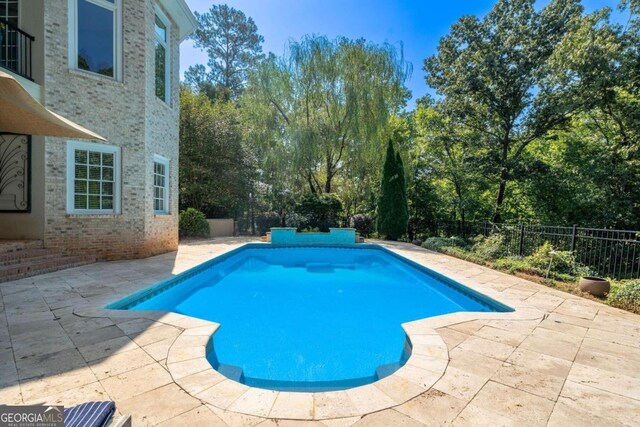 view of pool featuring a patio