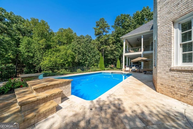 view of pool featuring a patio