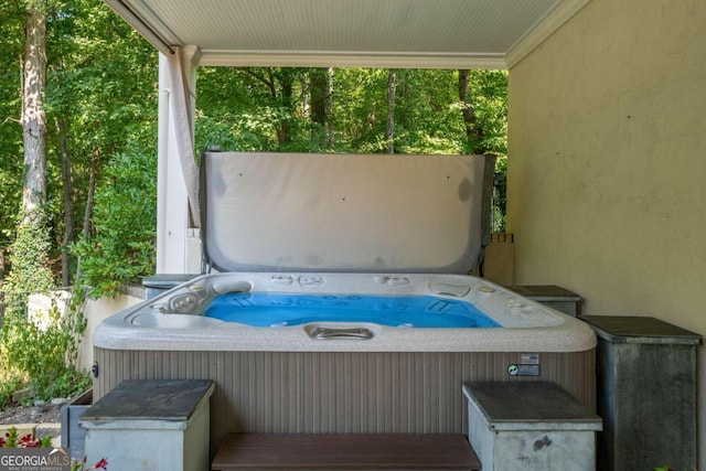 view of patio / terrace with a hot tub