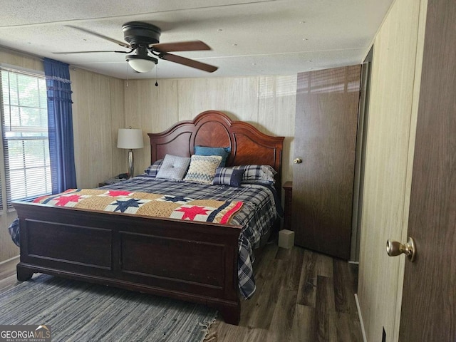 bedroom featuring dark wood-type flooring and ceiling fan