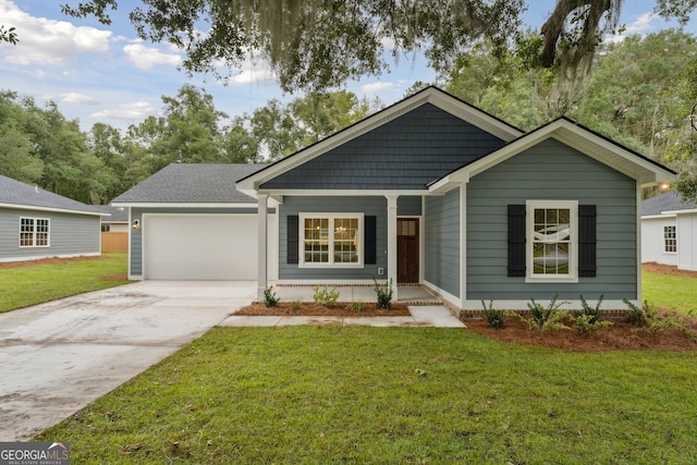 view of front of property featuring a garage, covered porch, and a front lawn