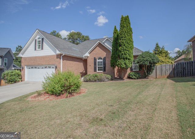 view of front property featuring a garage and a front yard