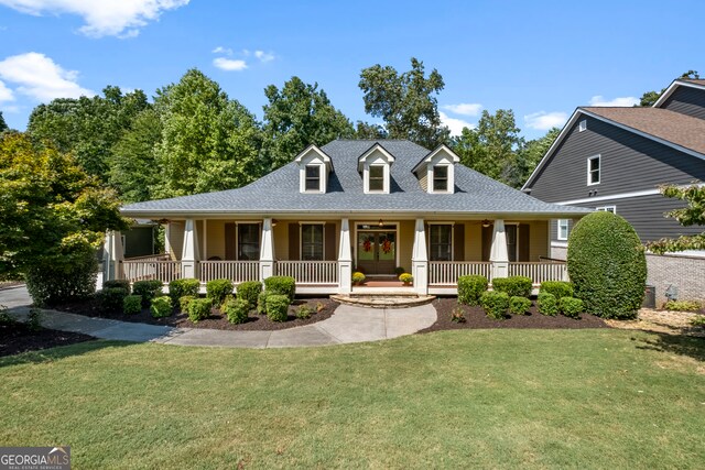 view of front of home featuring a front yard and covered porch