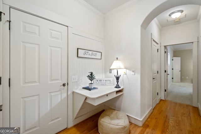 interior space with crown molding and hardwood / wood-style floors