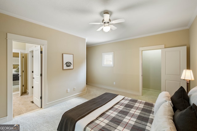 carpeted bedroom with ornamental molding and ceiling fan