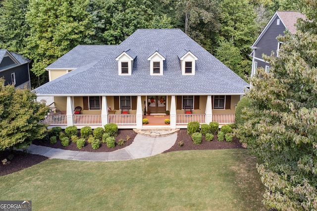 view of front of property with a front lawn and a porch