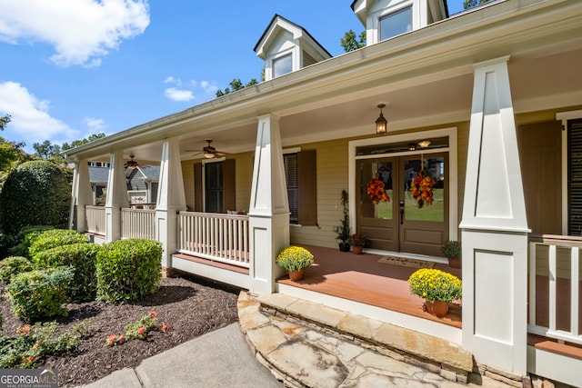 entrance to property with ceiling fan and covered porch