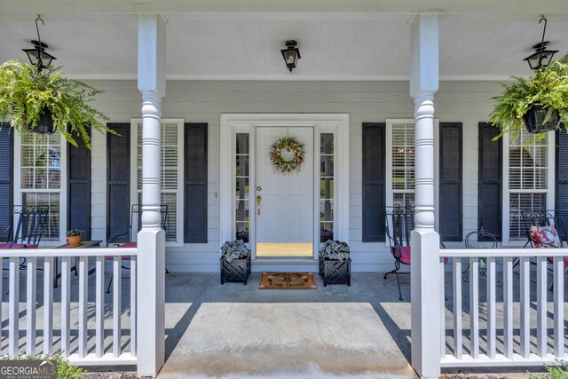 doorway to property with a porch