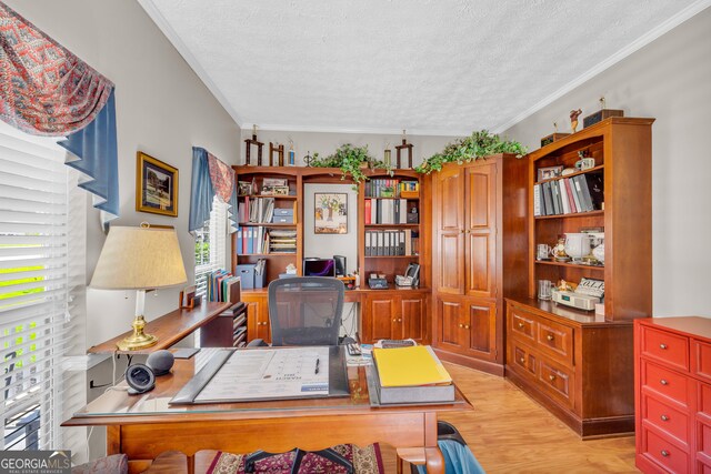 home office with a textured ceiling, light hardwood / wood-style flooring, and ornamental molding