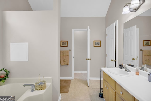 bathroom featuring a bathing tub and vanity