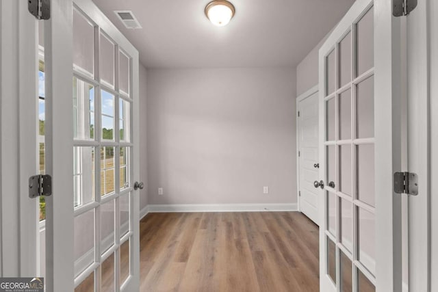 32 Joseph Ln, Hartwell, GA 30643 - unfurnished room with light wood finished floors and french doors