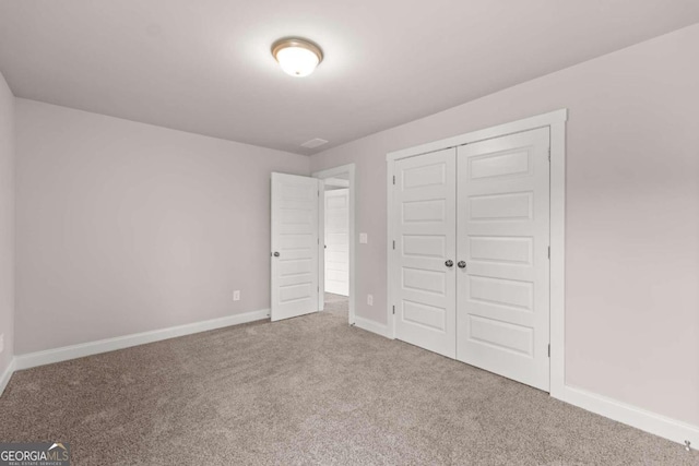 32 Joseph Ln, Hartwell, GA 30643 - unfurnished bedroom featuring carpet floors and a closet