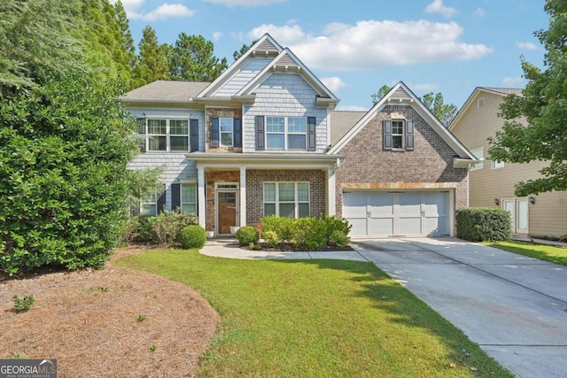 craftsman inspired home with a garage and a front lawn