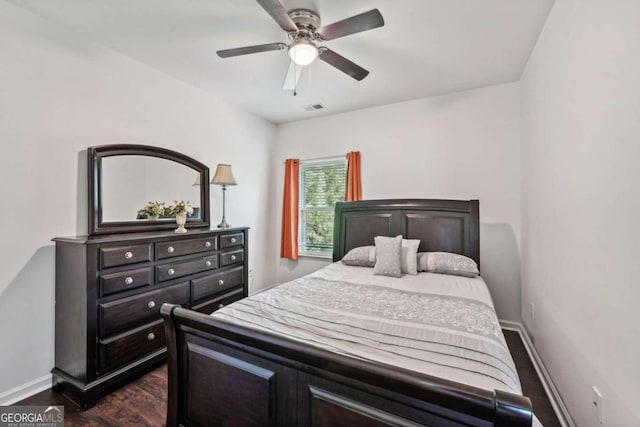 bedroom featuring ceiling fan and dark hardwood / wood-style floors