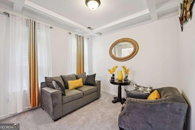 living room with coffered ceiling, beamed ceiling, and carpet floors