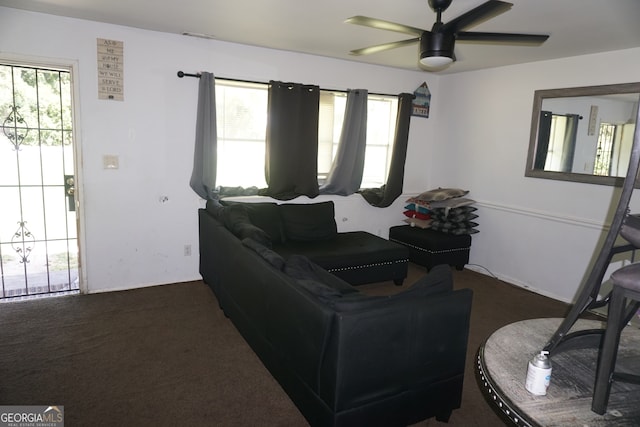 carpeted living room featuring ceiling fan