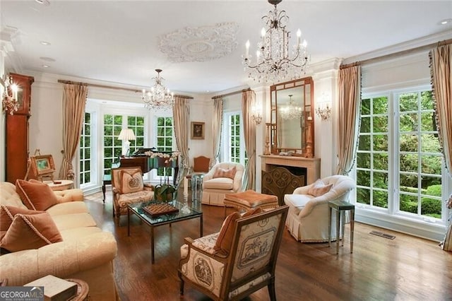 sitting room featuring ornamental molding, plenty of natural light, a notable chandelier, and dark hardwood / wood-style floors