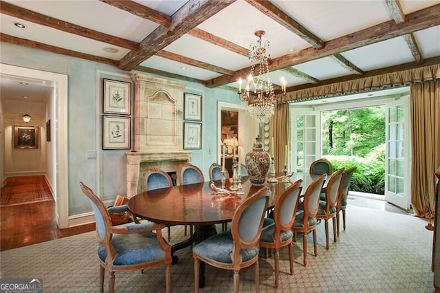 dining room with hardwood / wood-style flooring, beam ceiling, and a notable chandelier