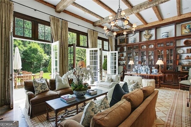 sunroom with a chandelier and beam ceiling