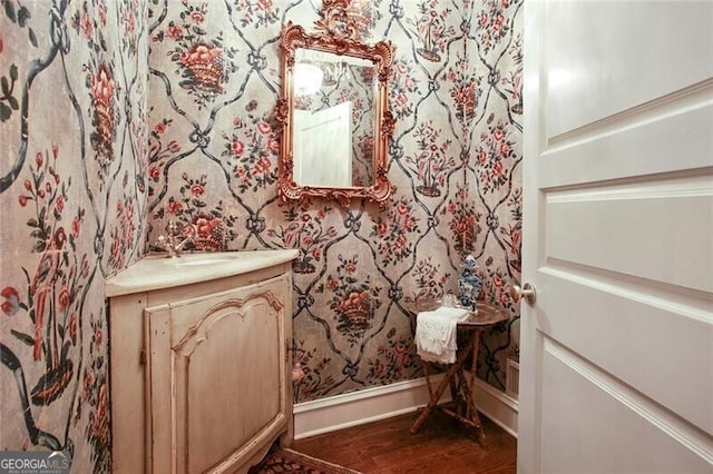 bathroom featuring hardwood / wood-style floors and vanity