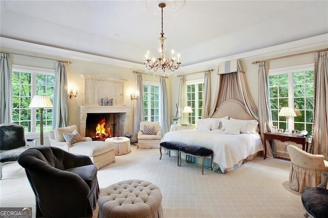 bedroom featuring carpet flooring and a chandelier