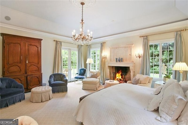 carpeted bedroom with a tray ceiling and an inviting chandelier