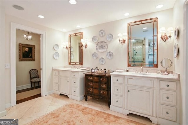 bathroom featuring tile patterned flooring, vanity, and walk in shower