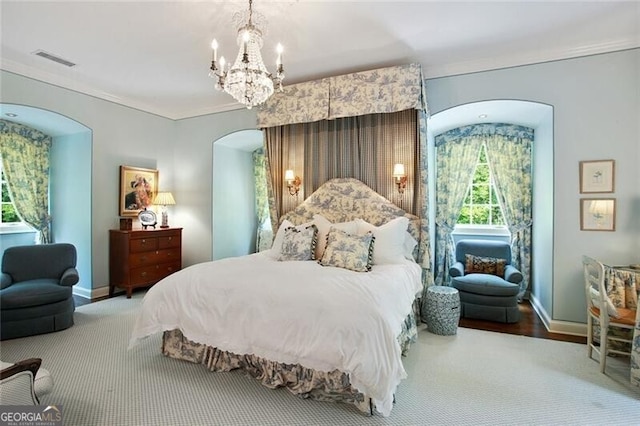 bedroom with wood-type flooring, a notable chandelier, and ornamental molding