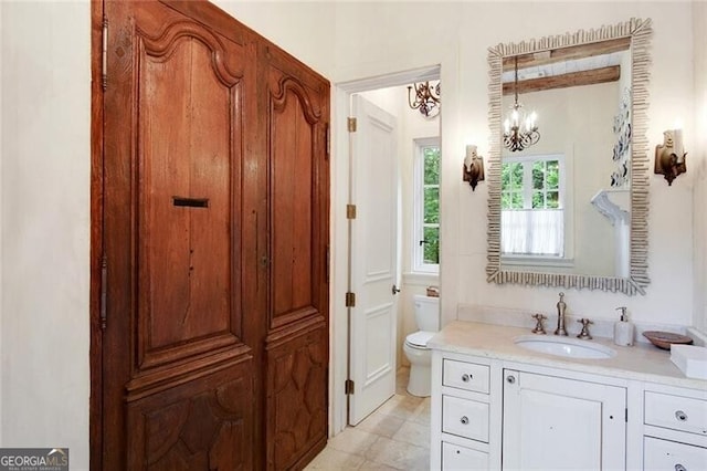 bathroom with tile patterned floors, toilet, and vanity