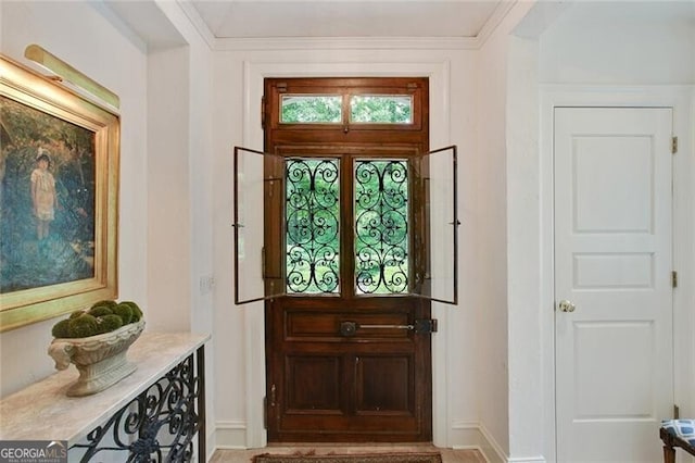 doorway featuring ornamental molding