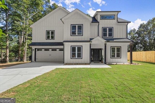 modern farmhouse featuring a garage and a front lawn