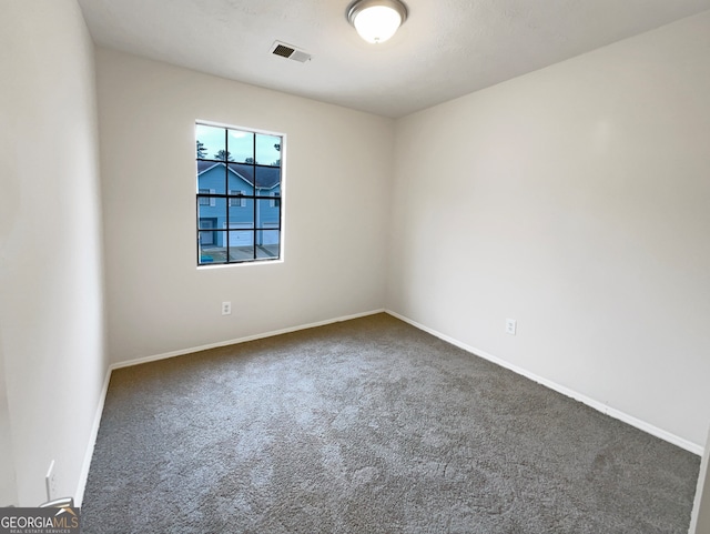 empty room with carpet flooring