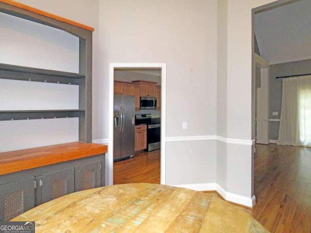 unfurnished dining area with dark hardwood / wood-style floors