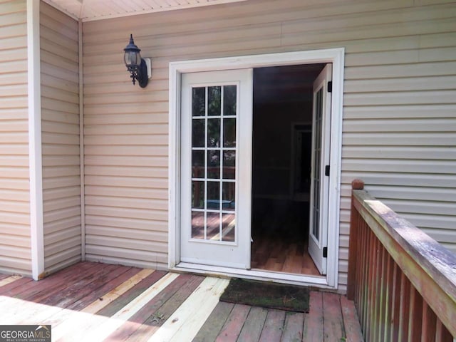 doorway to property featuring a wooden deck