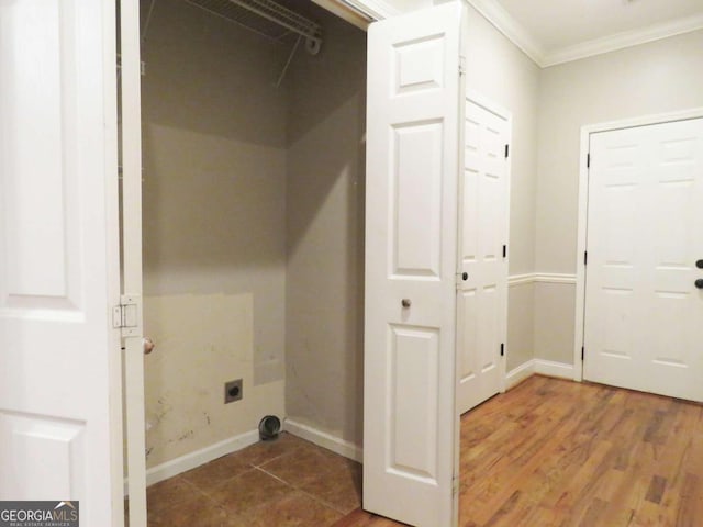 washroom featuring crown molding, hardwood / wood-style flooring, and hookup for an electric dryer