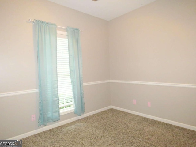 unfurnished room featuring carpet floors