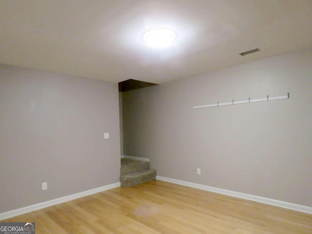 spare room featuring light hardwood / wood-style floors