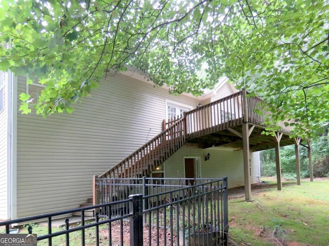 view of side of property featuring a wooden deck