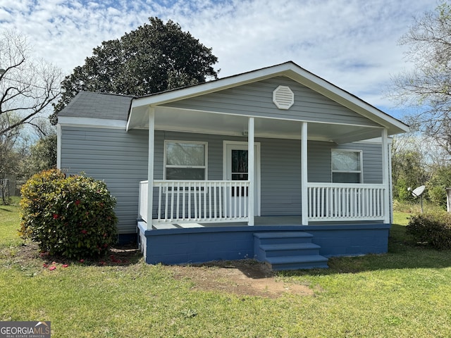 bungalow featuring a front yard and a porch