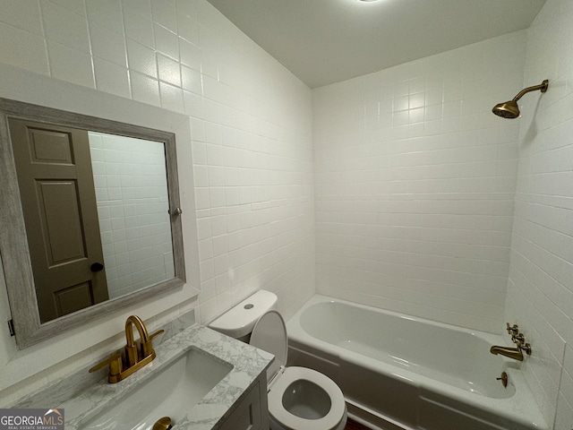 full bathroom featuring tile walls, tiled shower / bath, and toilet