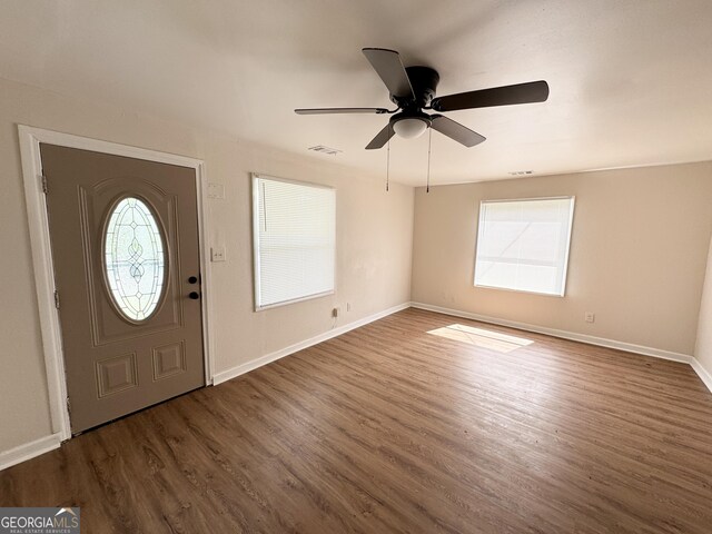 entrance foyer featuring dark wood-type flooring and ceiling fan