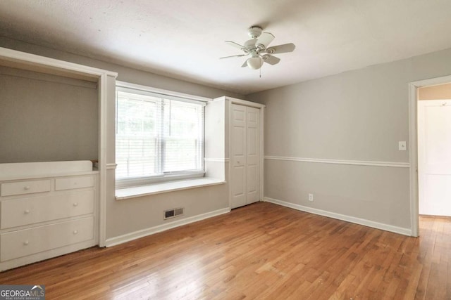 unfurnished bedroom with light hardwood / wood-style flooring and ceiling fan