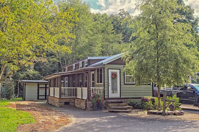 view of front facade with a shed