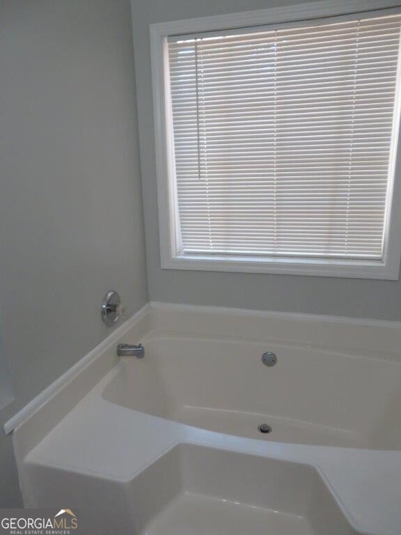 full bath featuring a garden tub