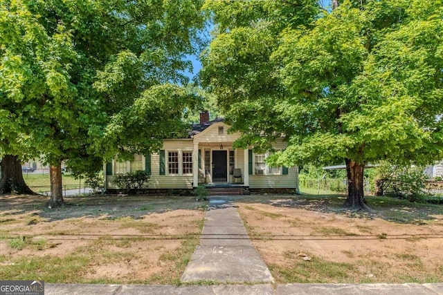 obstructed view of property with a porch