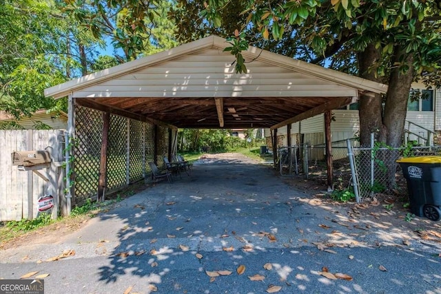 view of vehicle parking with a carport