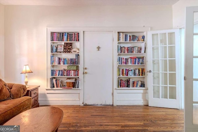 sitting room featuring light hardwood / wood-style flooring