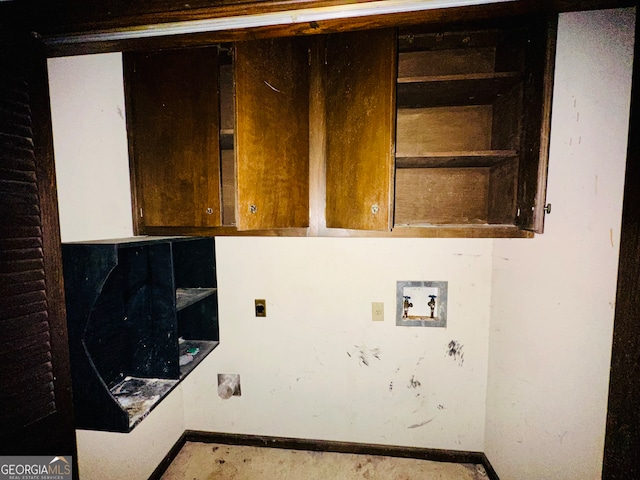 washroom featuring hookup for a washing machine, cabinets, and hookup for an electric dryer