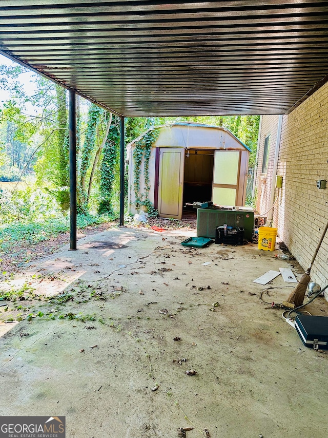 view of patio featuring a shed