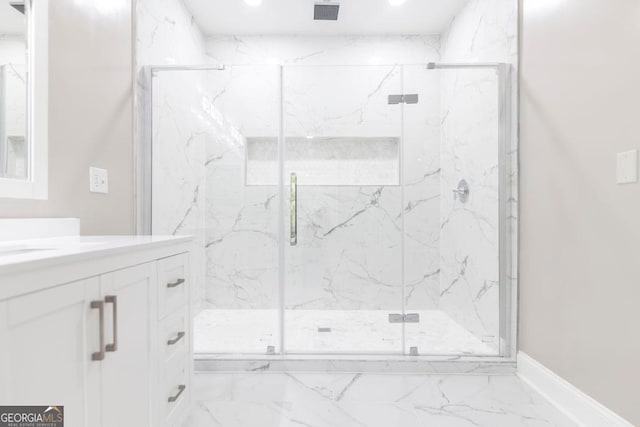 bathroom with vanity and walk in shower